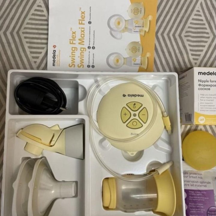 Молокоотсос medela swing flex